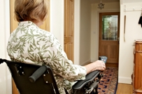 Woman in wheelchair in hallway
